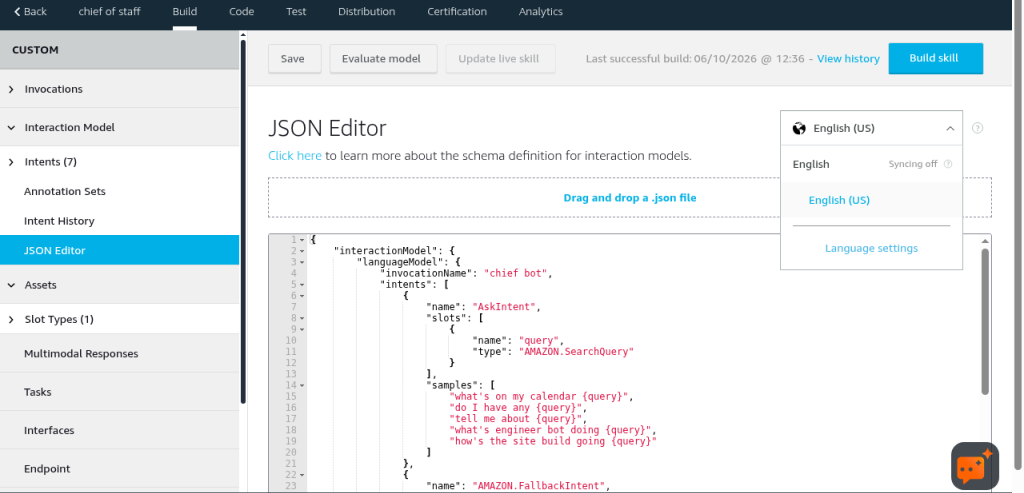 The JSON Editor with my model: one AskIntent and a query slot of type AMAZON.SearchQuery.